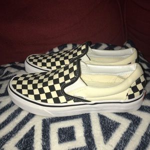 Checkered slip-on vans